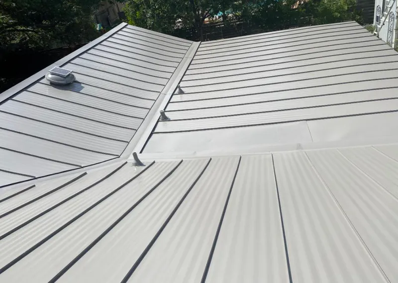 Solar attic fan installed on a metal roof for Roof Ventilation in Highland Heights